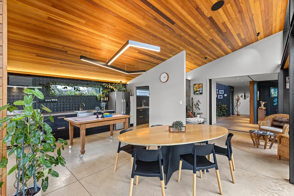 Extended open-plan living and dining area in an Auckland home